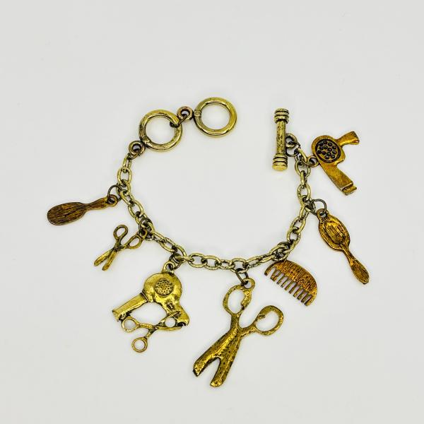 PULSERA FIGURAS BARBERIA BRONCE
